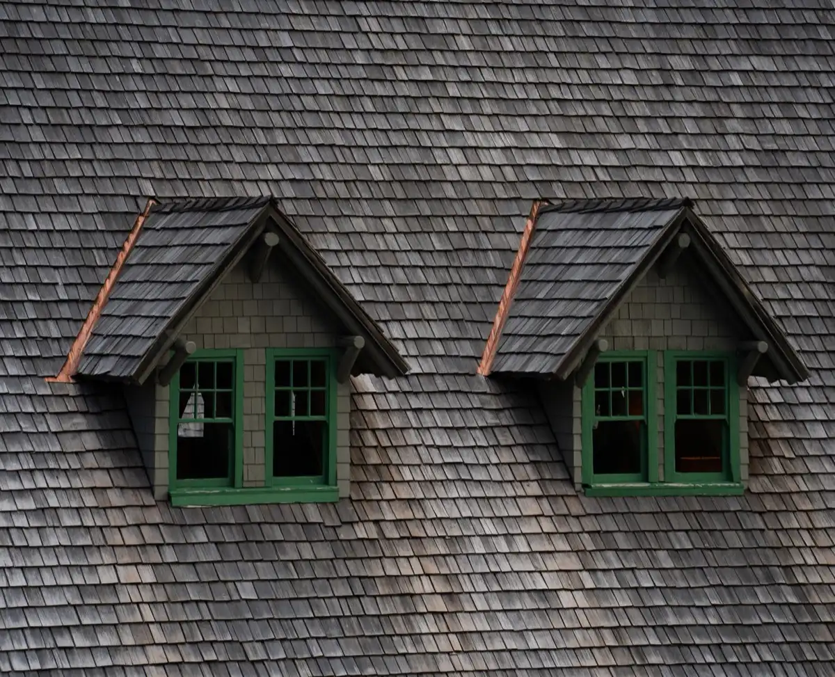 Dormers on a shingle roof in Aurora, IL, where step flashing and kickout flashing carry water past the walls