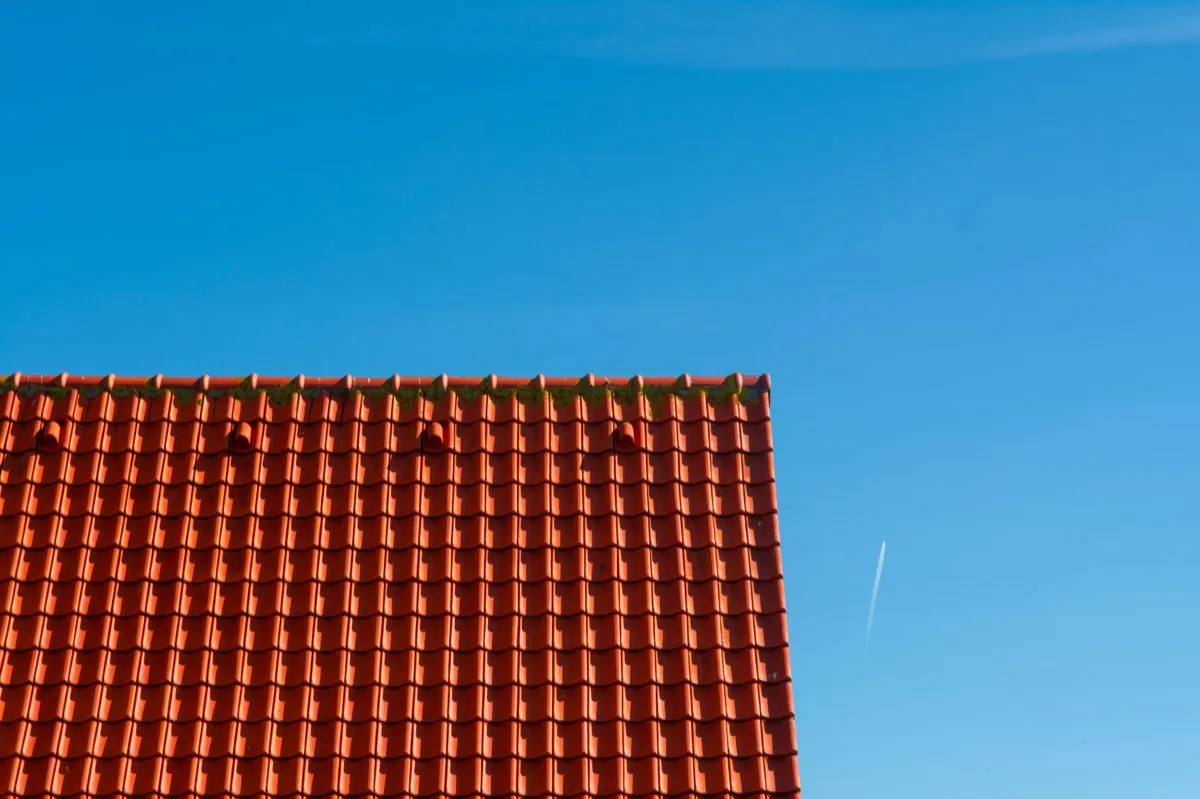 Tile roof gable in full sun, the kind of exposure that sets roof life in Aurora, IL